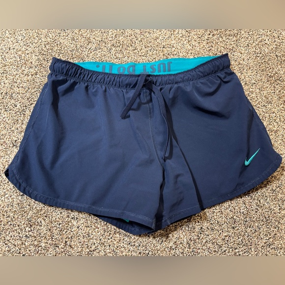 Nike Pants - Nike Dri-FIT running shorts in navy blue with a teal waistband and trim large